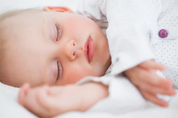 Baby sleeping on their side